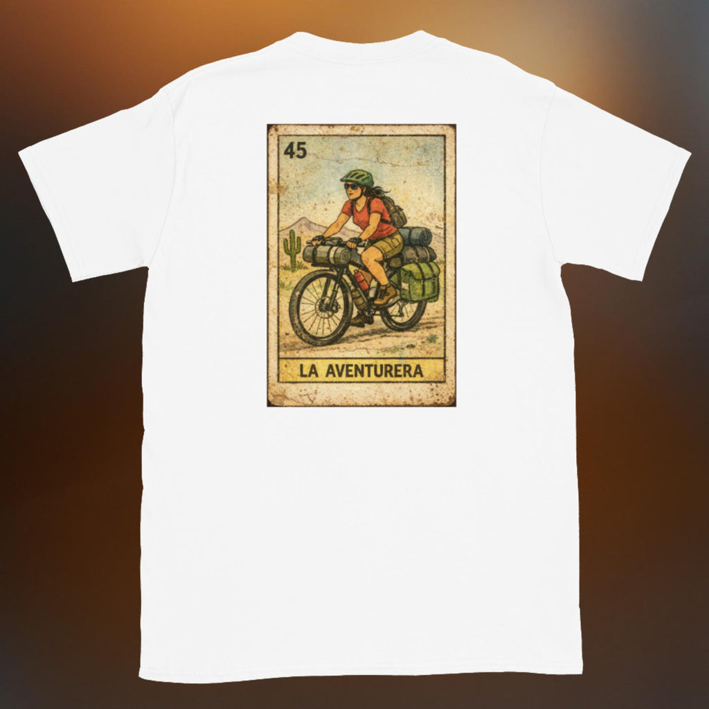 Latino apparel graphic tee featuring a vintage Mexican Loteria card design labeled "LA AVENTURERA" with a cyclist riding a bike, perfect for summer streetwear and cycling enthusiasts.