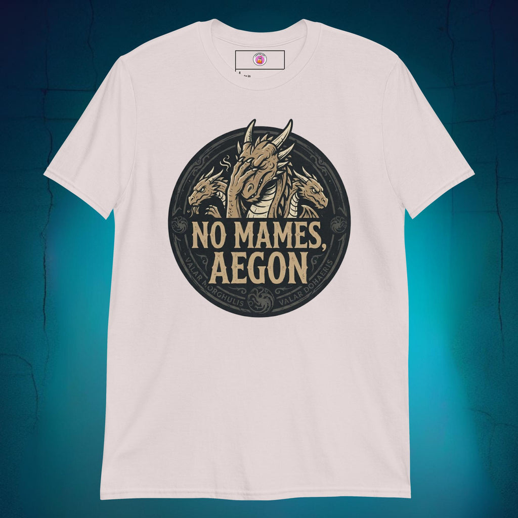 A close-up mockup of a unisex t-shirt featuring a graphic design of a dragon with a disappointed facial expression and the funny Spanish phrase text "no mames Aegon" written underneath.